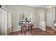 Inviting dining area featuring hardwood floors, natural light, and neutral decor at 3048 Misty Harbor Cir # E, Cramerton, NC 28032