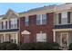 Inviting brick townhome featuring a well-maintained lawn and neutral exterior trim at 3048 Misty Harbor Cir # E, Cramerton, NC 28032