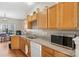Well-equipped kitchen featuring oak cabinets, modern appliances, and natural light at 3048 Misty Harbor Cir # E, Cramerton, NC 28032
