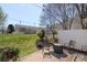 Inviting backyard patio with string lights, seating area, and well-maintained lawn offers a relaxing outdoor space at 3048 Misty Harbor Cir # E, Cramerton, NC 28032