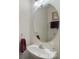 Small powder room with an oval mirror, and a pedestal sink at 3048 Misty Harbor Cir # E, Cramerton, NC 28032