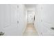 Bright hallway with light wood floors, white walls, and a door with a decorative glass insert at 3052 Ora Smith Rd, Lincolnton, NC 28092