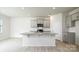 Bright kitchen with granite countertops, a kitchen island, gray cabinets, and stainless steel appliances at 3052 Ora Smith Rd, Lincolnton, NC 28092