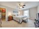 Bright bedroom featuring carpet, ceiling fan and a bed with a grey blanket at 324 Kerrydale Ct # 106, Clover, SC 29710