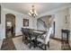 Cozy dining room with modern chandelier, wood table and a staircase view at 324 Kerrydale Ct # 106, Clover, SC 29710