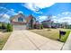 Two-story brick and stone home with a spacious driveway and well-kept lawn at 324 Kerrydale Ct # 106, Clover, SC 29710