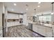 Well-lit kitchen boasts stainless appliances, granite counters, ample cabinet space and wood-look flooring at 324 Kerrydale Ct # 106, Clover, SC 29710