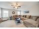 Spacious living room with a large sectional sofa, ceiling fan, and neutral color palette at 324 Kerrydale Ct # 106, Clover, SC 29710