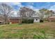 Wide open, grassy backyard of a property, with partial views of the home and surrounding neighborhood at 3509 Havenwood Rd, Dallas, NC 28034