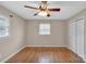 Bright bedroom with hardwood floors, neutral walls, a ceiling fan, and a closet at 3509 Havenwood Rd, Dallas, NC 28034