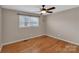 Cozy bedroom with hardwood flooring and a window providing natural light at 3509 Havenwood Rd, Dallas, NC 28034