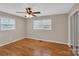 Bedroom with hardwood floors, a ceiling fan, and two windows for ample natural light at 3509 Havenwood Rd, Dallas, NC 28034