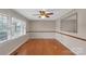Bright dining room featuring hardwood floors, a modern ceiling fan, and a large window at 3509 Havenwood Rd, Dallas, NC 28034