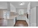 Eat-in kitchen with white cabinets, laminate counters, breakfast bar, and access to deck at 3509 Havenwood Rd, Dallas, NC 28034