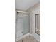 A full shot of a bathroom shower with sliding glass doors, next to a door with a mirror at 3509 Havenwood Rd, Dallas, NC 28034