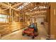 Interior view of a barn featuring a lawnmower, showcasing ample storage and functionality at 3526 Harmony Hwy, Harmony, NC 28634