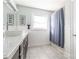 Bathroom features a large vanity with granite countertop, single sink, and a shower/tub with curtain at 3526 Harmony Hwy, Harmony, NC 28634
