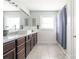 Bathroom features a large vanity with granite countertop, dual sinks, and a shower/tub with curtain at 3526 Harmony Hwy, Harmony, NC 28634