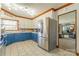Charming kitchen featuring blue cabinetry, stainless steel appliances, and ample counter space for cooking at 3526 Harmony Hwy, Harmony, NC 28634