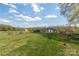 Distant blue barn and other outbuildings in a grassy pasture at 3526 Harmony Hwy, Harmony, NC 28634