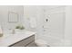 Clean, well-lit bathroom with shower, tub, modern vanity, and decorative art at 3543 Cramer Creek Dr, Gastonia, NC 28056