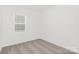 This bedroom has neutral carpet, light colored walls, and a single window at 3543 Cramer Creek Dr, Gastonia, NC 28056