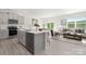 Bright open-concept kitchen featuring modern appliances and a seamless flow to the living area at 3543 Cramer Creek Dr, Gastonia, NC 28056