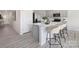 Modern kitchen featuring an island with seating, stainless steel appliances, and sleek countertops at 3543 Cramer Creek Dr, Gastonia, NC 28056