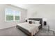 Serene bedroom with large window, neutral tones, plush carpet, and stylish décor at 3543 Cramer Creek Dr, Gastonia, NC 28056