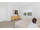 Cozy bedroom with natural light, modern furniture, dresser, and serene ambiance at 3543 Cramer Creek Dr, Gastonia, NC 28056