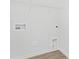 This utility room has wood-look vinyl floors and wire shelving at 3543 Cramer Creek Dr, Gastonia, NC 28056