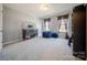 Bedroom featuring light grey walls, large windows and comfortable beanbag chairs at 3613 Martele Dr, Mint Hill, NC 28227