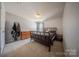 Simple bedroom with dark wood bed frame and a large dresser at 3613 Martele Dr, Mint Hill, NC 28227