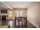 The dining room includes a modern light fixture and dark wooden floors and a fireplace at 3613 Martele Dr, Mint Hill, NC 28227