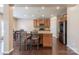 A kitchen featuring wooden cabinets, stainless steel appliances, granite countertops, and a kitchen island with barstool seating at 3613 Martele Dr, Mint Hill, NC 28227