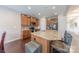 Beautiful kitchen island with granite countertops, stainless appliances, and wood cabinets at 3613 Martele Dr, Mint Hill, NC 28227