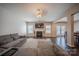 An expansive living room includes hardwood flooring, a fireplace, and natural light at 3613 Martele Dr, Mint Hill, NC 28227