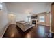 A comfortable living room with a large sectional sofa, fireplace, and hardwood floors at 3613 Martele Dr, Mint Hill, NC 28227