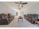 An expansive living room featuring plush seating, carpet flooring, and ceiling fans at 3613 Martele Dr, Mint Hill, NC 28227