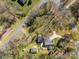 Aerial view of home with a backyard deck, a driveway, and mature trees at 3647 Glen Haven Sw Dr, Concord, NC 28027