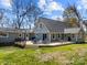 Expansive wooden deck on a home with green siding, offering ample space for outdoor furniture and entertaining at 3647 Glen Haven Sw Dr, Concord, NC 28027