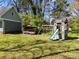 Backyard features a playset, swing, and additional storage for outdoor fun at 3647 Glen Haven Sw Dr, Concord, NC 28027