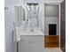 Bright bathroom featuring a modern vanity, updated light fixture, and neutral color palette at 3647 Glen Haven Sw Dr, Concord, NC 28027