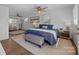 Bright bedroom with a large bed, ceiling fan, area rug, and lots of natural light from the window at 3647 Glen Haven Sw Dr, Concord, NC 28027