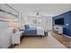 Spacious bedroom featuring a ceiling fan, large bed, dresser, tv, and natural light at 3647 Glen Haven Sw Dr, Concord, NC 28027