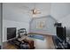 Exercise room with weight rack and machine and ceiling fan at 3647 Glen Haven Sw Dr, Concord, NC 28027