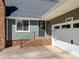 Charming home featuring a brick foundation, gray siding and an attached garage at 3647 Glen Haven Sw Dr, Concord, NC 28027