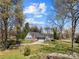 Charming single-story home with lush front yard, mature trees, and attached two-car garage at 3647 Glen Haven Sw Dr, Concord, NC 28027