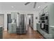 Kitchen featuring stainless steel appliances, gray cabinets, and hardwood floors at 3647 Glen Haven Sw Dr, Concord, NC 28027