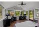 Bright home office features hardwood floors, large windows, and desks for dual workstations at 3647 Glen Haven Sw Dr, Concord, NC 28027